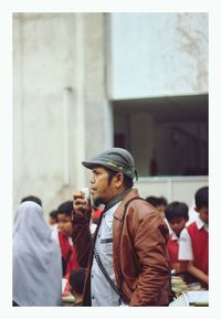 People standing against wall