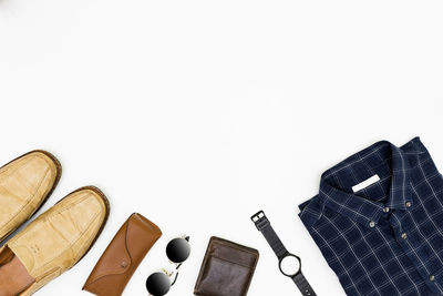 High angle view of shoes on table against white background