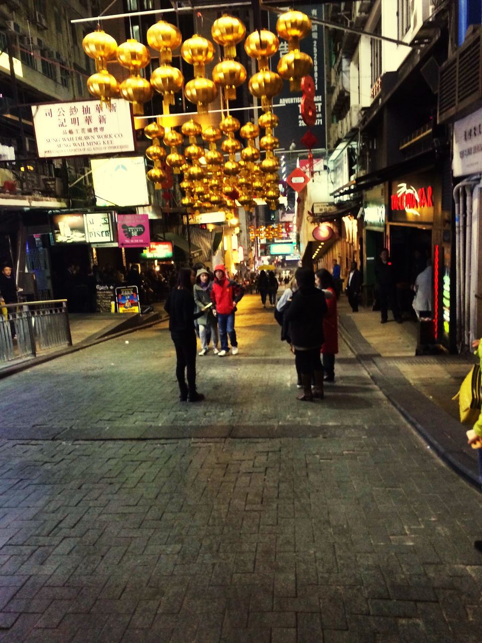 street, men, building exterior, lifestyles, person, city, retail, walking, market, architecture, city life, market stall, built structure, store, incidental people, rear view, leisure activity, food and drink