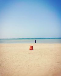 Scenic view of beach against clear sky