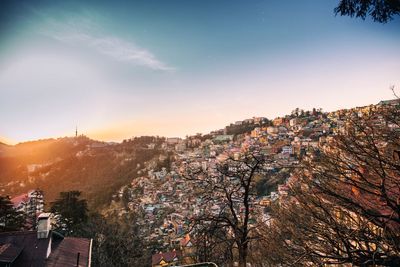 Cityscape against sky during sunset