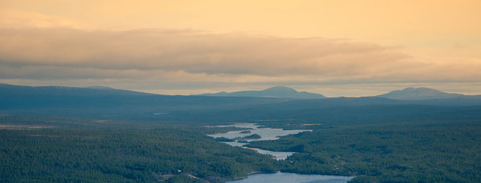 Scenic view of landscape against sky during sunset