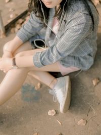 High angle view of woman sitting outdoors