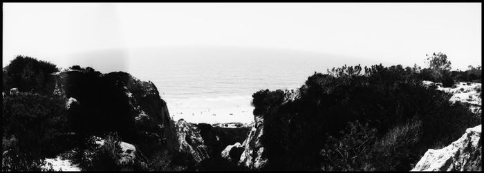 Panoramic view of bay against clear sky