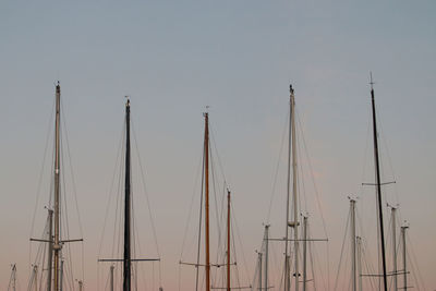 Low angle view of sailboats against clear sky