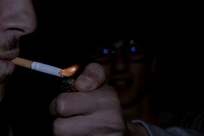 Close-up of man smoking cigarette