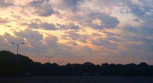 Scenic view of landscape against cloudy sky