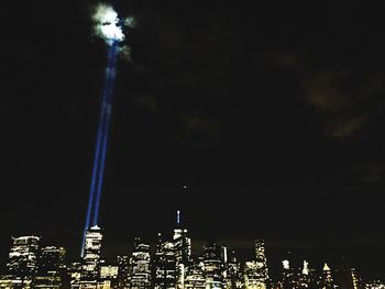 Low angle view of modern skyscraper at night