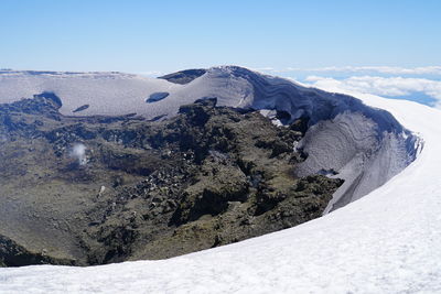 Close-up of snow covered landscape against clear sky