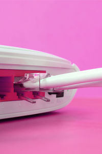 Close-up of toy over pink background