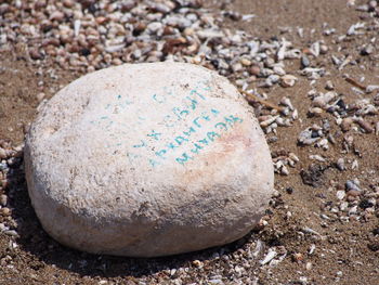 Close-up of pebbles on sand