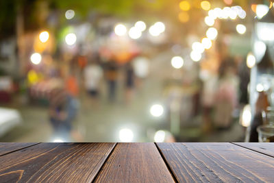 Close-up of illuminated lights on table at night