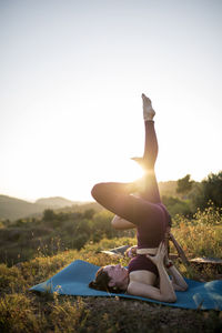 Woman standing on land against sky