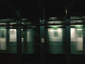 Illuminated train at night