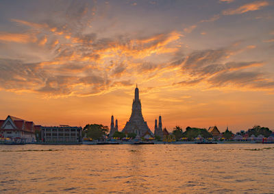 View of temple building against sky during sunset