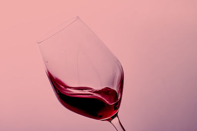 Close-up of red wine against white background