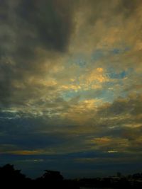 Low angle view of dramatic sky during sunset