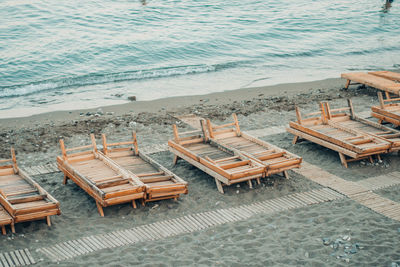 High angle view of chairs at beach