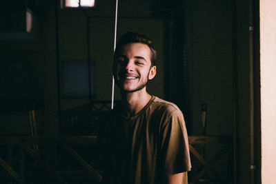 Portrait of young man at home