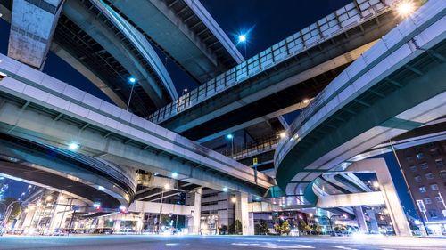 Illuminated street lights in city at night