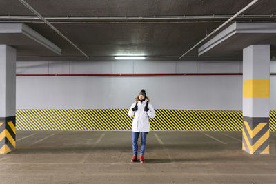 Man standing in parking garage