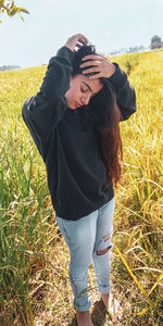 Woman standing on field