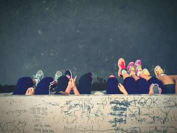 Group of people in front of text