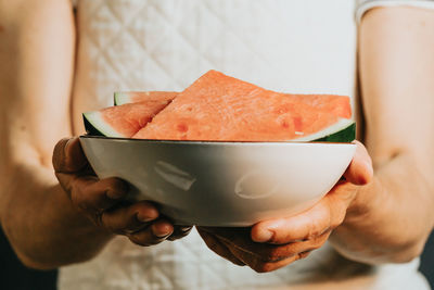 Midsection of woman holding food