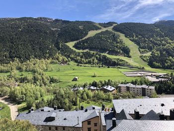 High angle view of houses and trees against sky