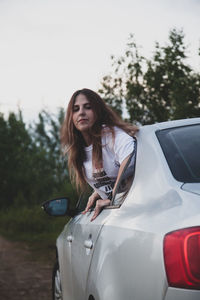 Portrait of beautiful woman in car