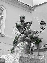 Low angle view of statue against building