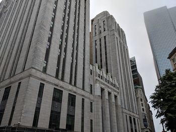 Low angle view of modern buildings against clear sky