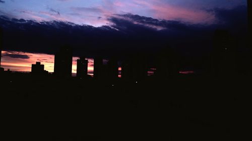 Silhouette built structure against sky