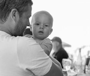 Close-up of father holding baby at restaurant