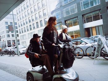 People walking on street in city