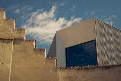 Low angle view of old building against sky