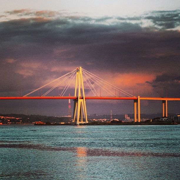 connection, bridge - man made structure, sky, transportation, engineering, suspension bridge, built structure, water, architecture, waterfront, illuminated, cloud - sky, bridge, sunset, river, sea, dusk, cloudy, cable-stayed bridge, cloud