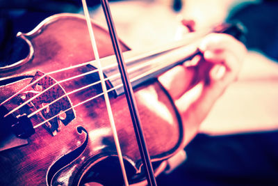 Close-up of hands playing guitar