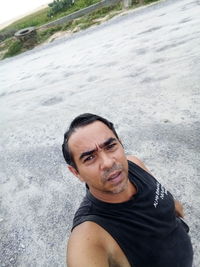 Portrait of young man on beach