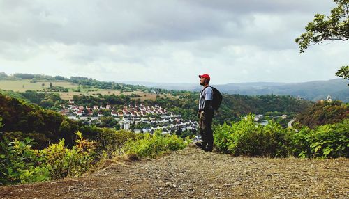 Man standing against landscape