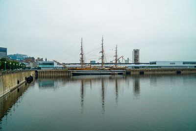 Harbor by sea against sky