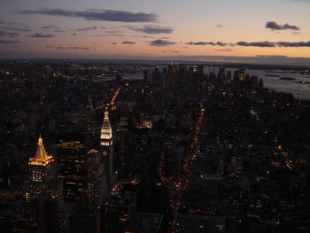 Aerial view of city lit up at night