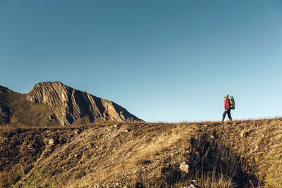 Woman hiking and exploring the mountains