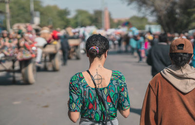 Rear view of women standing on street