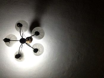 Low angle view of lamp hanging at home