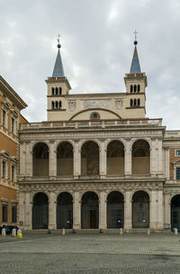 Facade of historic building against sky