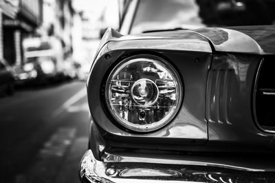 Close-up of vintage car on street