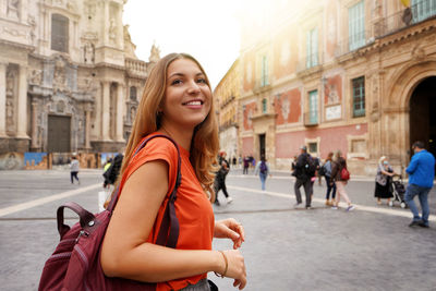 Beautiful excited school exchange girl visiting europe within the exchange program