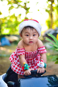 Portrait of cute baby boy playing in playground