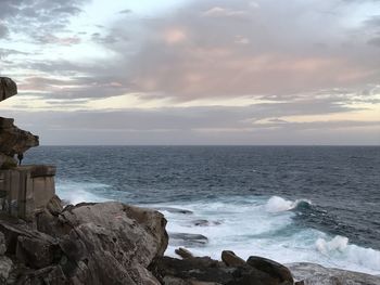 Scenic view of sea against cloudy sky